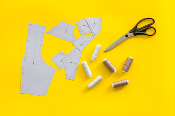 Sewing patterns on tailor or dressmaker table, sewing dress workshop concept