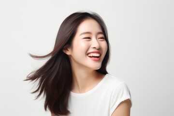 Studio Photo of Radiant Young Woman Laughing. Photo Concept for Cosmetic Ads.