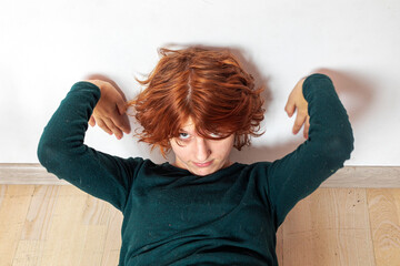  close-up portrait of a pensive teenage girl with red hair with a stylish anime hairstyle