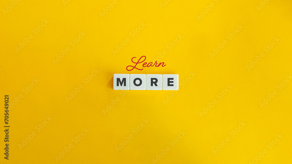 Wall mural learn more banner. block letter tiles and cursive text on flat yellow orange background. minimalist 