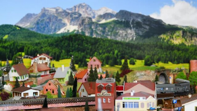 Model freight train moving on a mountain ambientation. Model railway.