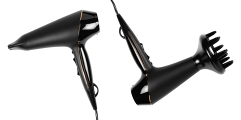 Black Hair Dryer Isolated on White Background. Hair Care Tool. Metallic Rosy Ionic Hairdryer. Domestic Small Appliances. Household Equipment. Electric Home Appliance. Professional Hair Style Tool