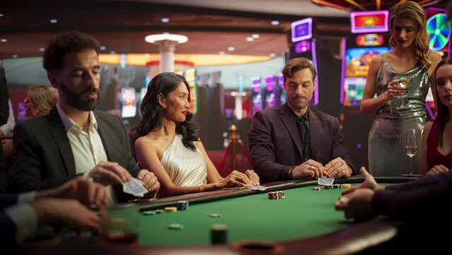 Diverse Group Playing Poker in a Luxurious Casino, Strategically Betting. High-Stakes, Focused Gamblers Analyzing Moves, Tension Rising on a Competitive Gambling Championship. Slow Motion