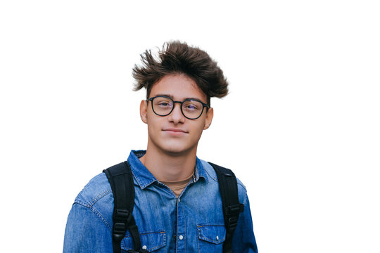 Brown haired smart teen boy in jeans shirt carrying backpack looks at camera wearing glasses against transparent background. Purposeful student ready to improve. Knowledge