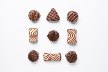 Flat lay of assortment of delicious chocolate candies isolated on white background. Flat lay, top view.