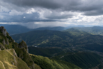 Fototapeta na wymiar Downpour over mountains and gloomy clouds, view from Vlasic mountain