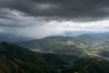 Fototapeta na wymiar Downpour over mountains and gloomy clouds, view from Vlasic mountain