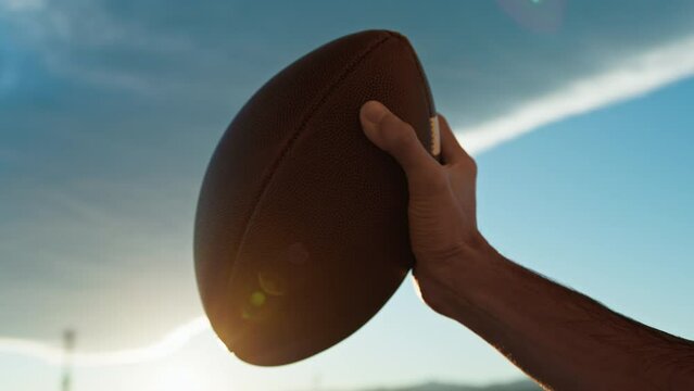 American football ball at sunset