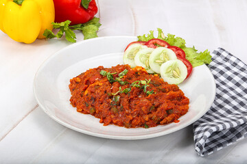 Shaakshuka eggs with tomato and herbs
