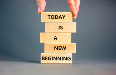Today is a new beginning symbol. Concept words Today is a new beginning on wooden blocks. Beautiful...