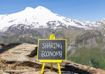 Sharing economy symbol. Concept words Sharing economy on beautiful black chalk blackboard....