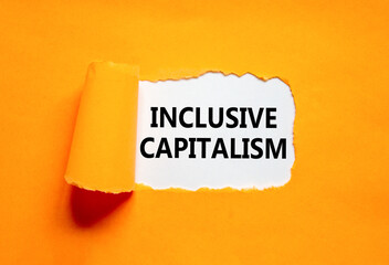 Inclusive capitalism symbol. Concept words Inclusive capitalism on beautiful white paper. Beautiful orange paper background. Business inclusive capitalism concept. Copy space.