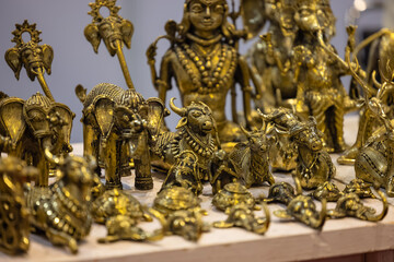 Brass metal art, Handmade Indian cultural sculpture souvenir made with brass with plain background. Selective focus.