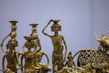 Fototapeta na wymiar Brass metal art, Handmade Indian cultural sculpture souvenir made with brass with plain background. Selective focus.