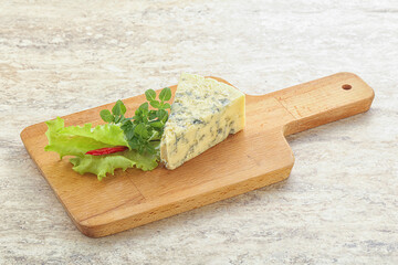 Blue cheese piece over board