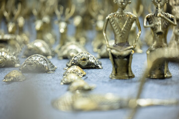 Brass metal art, Handmade Indian cultural sculpture souvenir made with brass with plain background. Selective focus.