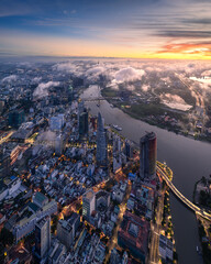 Aerial photo of downtown Ho Chi Minh City, Vietnam's largest city with high-rise buildings next to the riverbank.