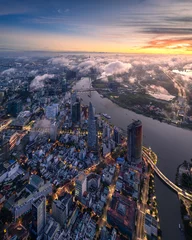 Poster Aerial photo of downtown Ho Chi Minh City, Vietnam's largest city with high-rise buildings next to the riverbank. © Trung Nguyen