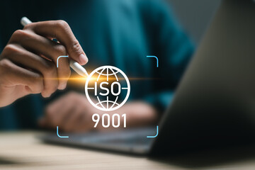 ISO 9001 Standard certification standardisation quality control concept, businessman use laptop with virtual screen of ISO 9001 symbol for quality management of organizations. - obrazy, fototapety, plakaty