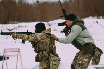 Military training. People training in tactical shooting.