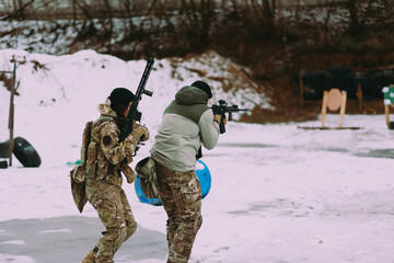Military training. People training in tactical shooting.