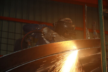 Steel welder builds technical, industrial steel welder in technical factory