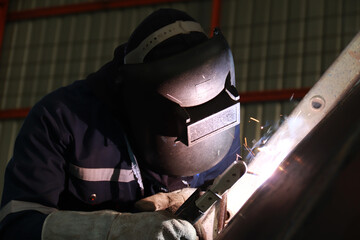 Steel welder builds technical, industrial steel welder in technical factory
