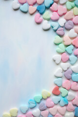 Obraz na płótnie Canvas Colorful heart-shaped marshmallow on a blue background. Valentine's Day.