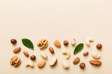 Composition of nuts , flat lay - mix hazelnuts, cashews, almonds on table background. healthy...