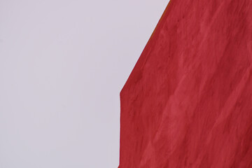 A red wall with perspective against a pale white sky. Blank, mockup for inscriptions, copy space,...