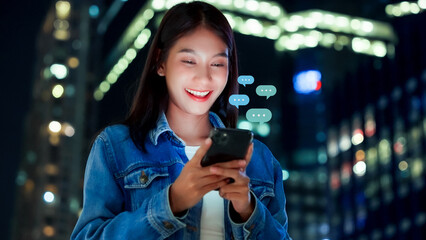 Hand of woman typing text on mobile smartphone in city night life. Online live chat chatting on application communication digital media website and social network