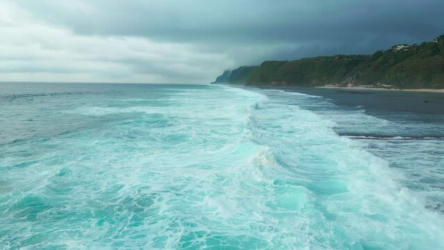 Aerial view on coast with sea and big waves on Sao Miguel Island, Azores at cloudy time.