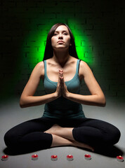 Fototapeta premium Attractive young woman doing yoga