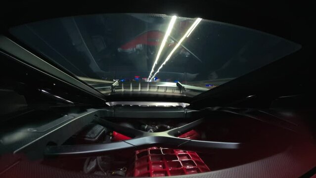 Hyper lapse of engine supercar luxury Lamborghini Huracan car driving on the street at night