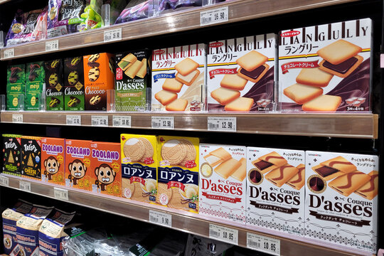 PENANG, MALAYSIA - 1 DEC 2023: Jaya Grocer store features a display shelf presenting a diverse range of candies, crackers and snacks imported from Japan. A delightful Japanese treats to enjoy.