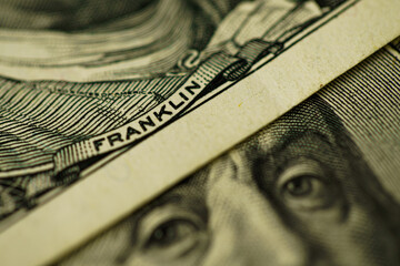100 dollar bill with Benjamin Franklin face macro shot. Close up portrait of Benjamin Franklin on...