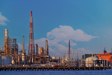 Fototapeta na wymiar Japan industrial factory area with blue sky background view from Fishing port, Yokohama City Japan.