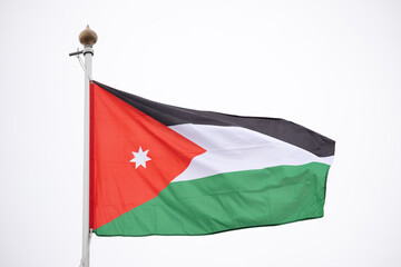 Fototapeta premium Large Jordan flag fluttering in the wind..Flag of the Jordanian Arab Resistance to the Ottoman Empire.