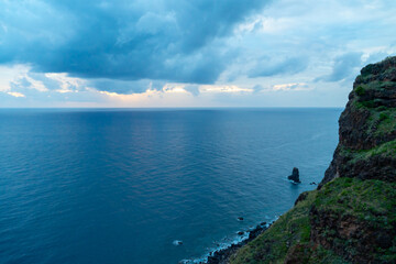 Fototapeta na wymiar Sunset over the ocean from a hiking trail at madeira island