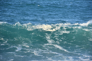 Blue sea water waves, in two different blue shades with foam. Waves texture background