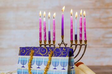Candle light during Hanukkah celebrations Hanukkiah Menorah Jewish religion holiday symbol