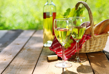 Cheese, grapes, bread and two glasses of the white wine