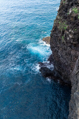 Waves crashing on volcanic rocks on Madeira