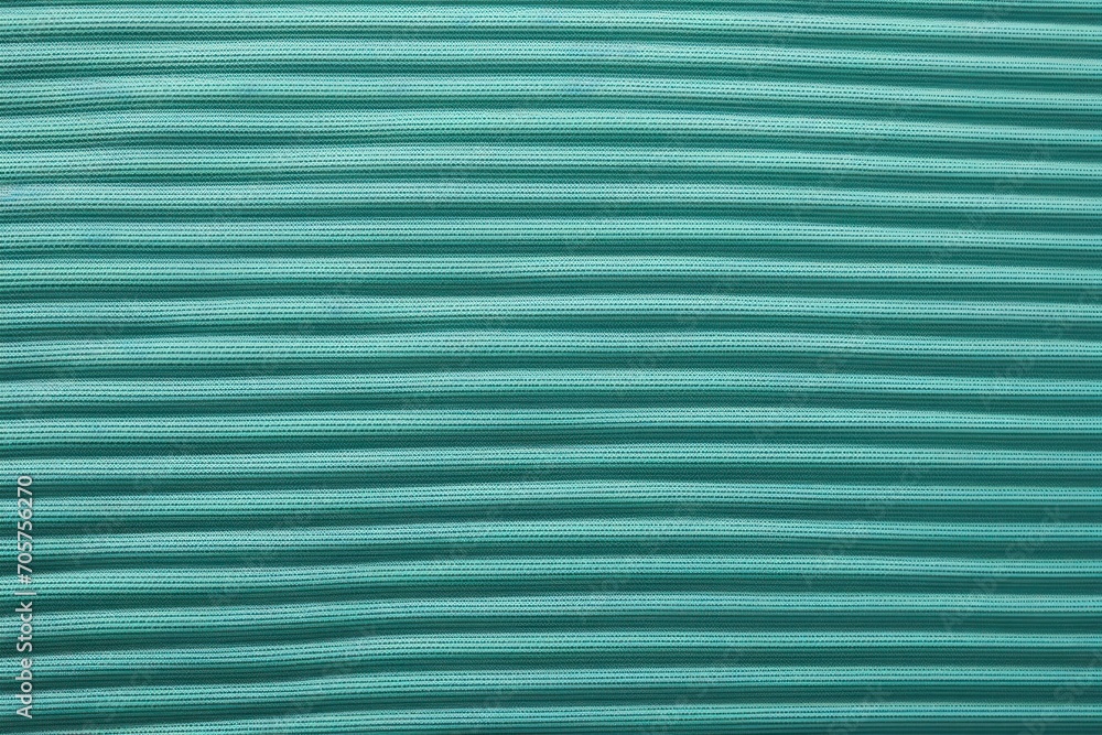 Poster a close up view of a teal green fabric textured with thin horizontal horizontal lines and horizontal