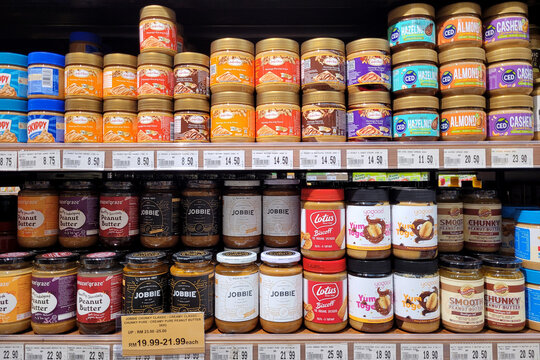 PENANG, MALAYSIA - 1 DEC 2023: Various choices of chocolate and peanut butter spread on the display shelves in Jaya Grocery Store. Jaya Grocer is a trusted supermarket brand in Malaysia.