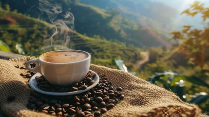 Fotobehang Hot coffee cup with organic coffee beans on the wooden table and the plantations background with © Anna