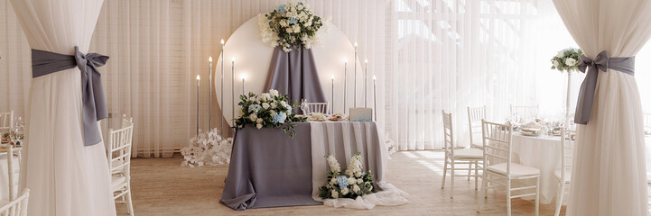 A view inside a marquee set up for a wedding reception. Banner with copy space.