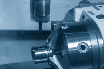 The 4 axis machining center cutting the automotive parts  parts with ball end mill tool.