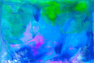 Obraz na płótnie Canvas Bright colorful acrylic texture. Liquid flowing acrylic on canvas. Marble texture in rainbow colors. Hand made abstract artwork with pink, blue, green and yellow colors.