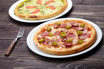 tasty pizza on the wooden background